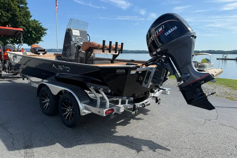 Slide: The Image of Avid 207 Recon 2027 boat with Yamaha motor on trailer by lake. - 4