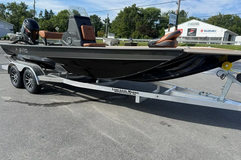 Slide: The Image of Avid 207 Recon boat on trailer at marina, 2027 model. - 8