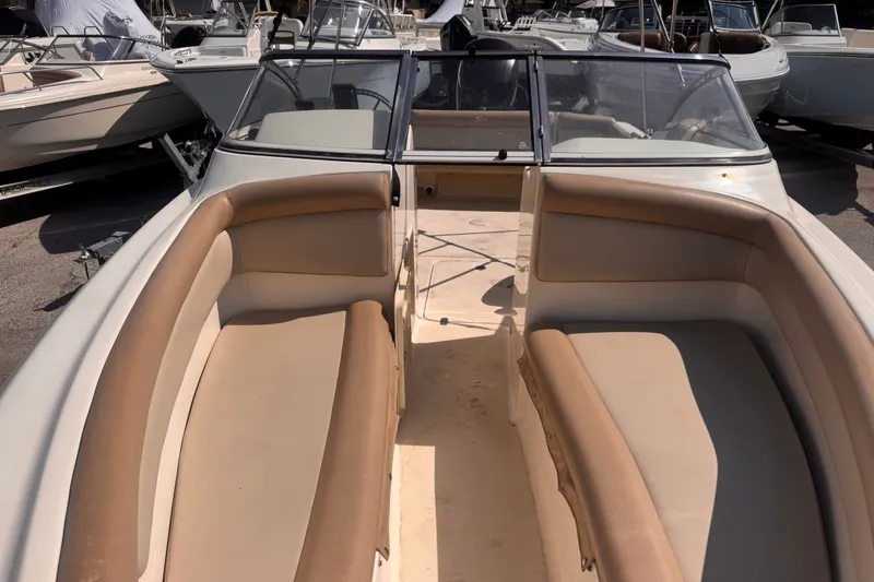 Slide: The Image of 2023 Scout 210 Dorado boat interior with tan seating and windshield. - 14