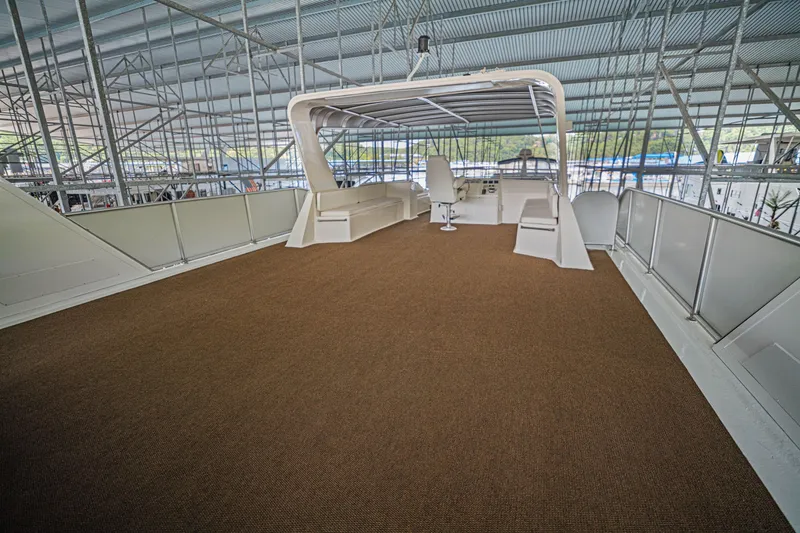 Slide: The Image of Upper deck of 2011 STARDUST 18 x 85 houseboat, featuring spacious seating and helm. - 24
