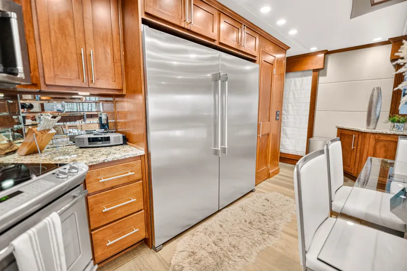Slide: The Image of Luxurious kitchen with stainless steel appliances, wooden cabinets, and modern decor on a STARDUST 18 x 85. - 15