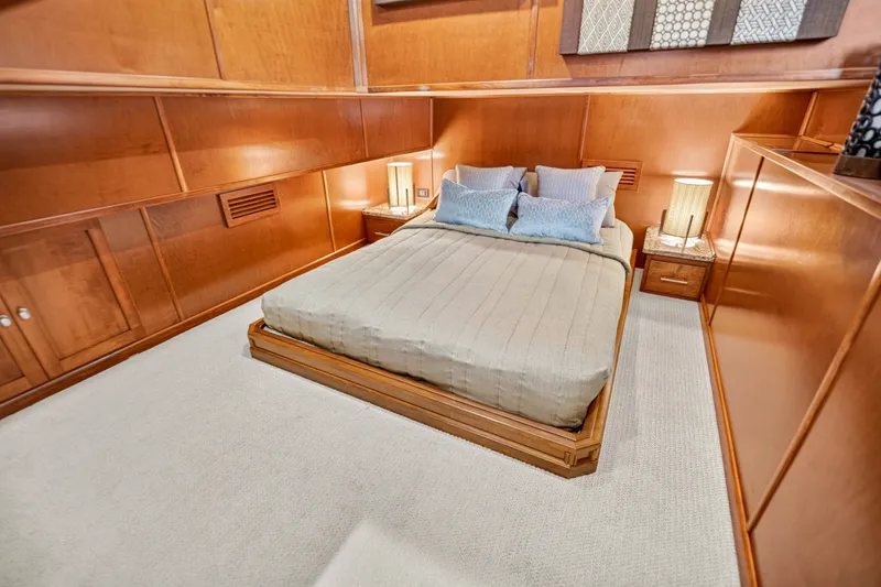 Slide: The Image of Luxurious bedroom interior on 2011 STARDUST 18 x 85 houseboat with wooden paneling and cozy bedding. - 21