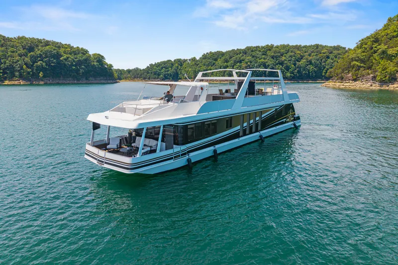 Slide: The Image of Luxurious 2011 STARDUST 18 x 85 houseboat cruising on a serene lake. - 8