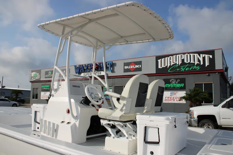 Slide: The Image of 2025 Mamba 24 Cat Elite boat at Waypoint Customs, featuring dual seats and a T-top. - 20