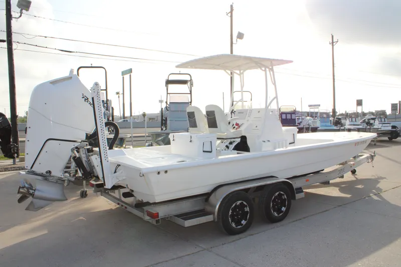 Slide: The Image of 2025 Mamba 24 Cat Elite boat on trailer, featuring a powerful outboard motor. - 16