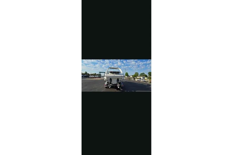 Slide: The Image of 2021 Monterey 328SS Super Sport boat on trailer under blue sky. - 19
