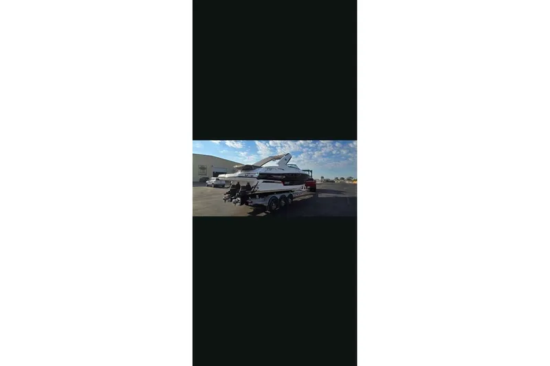 Slide: The Image of 2021 Monterey 328SS Super Sport boat on trailer in parking lot. - 17