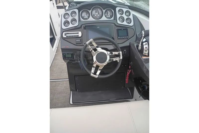 Slide: The Image of Steering console of 2021 Monterey 328SS Super Sport boat with modern controls and gauges. - 16