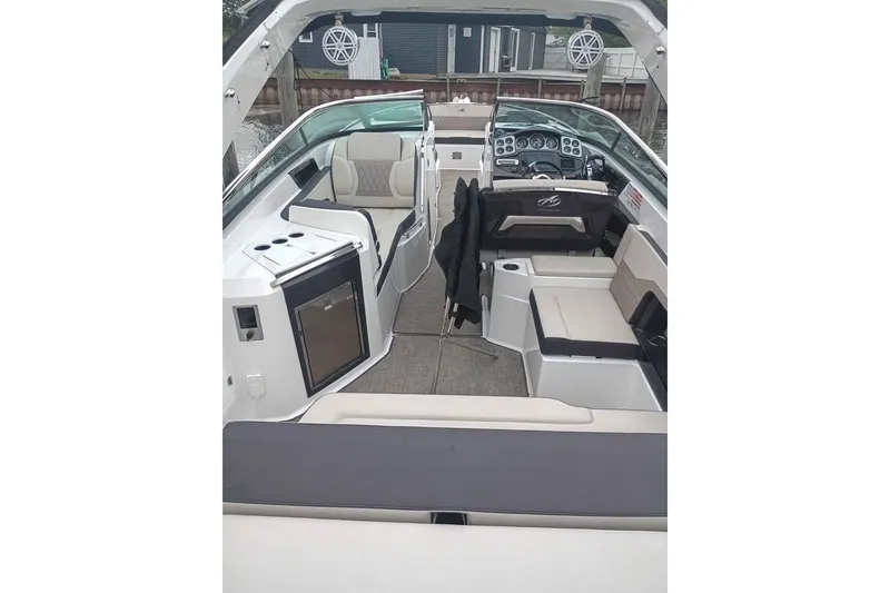 Slide: The Image of Interior of a 2021 Monterey 328SS Super Sport boat with luxurious seating and modern amenities. - 20