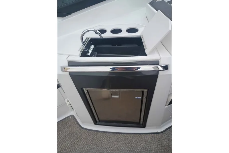 Slide: The Image of 2021 Monterey 328SS Super Sport boat kitchenette with sink and storage. - 14