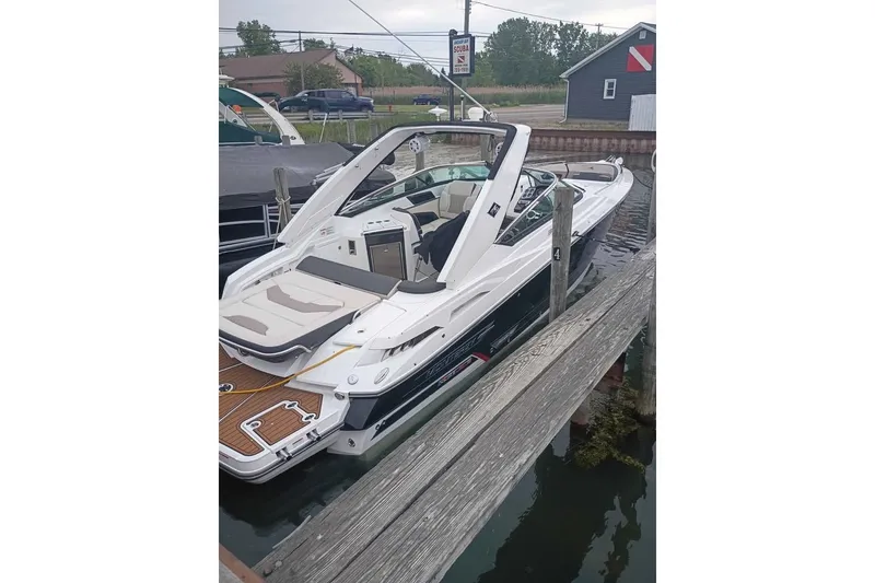 The Image of 2021 Monterey 328SS Super Sport boat docked at a marina, showcasing sleek design. - 21