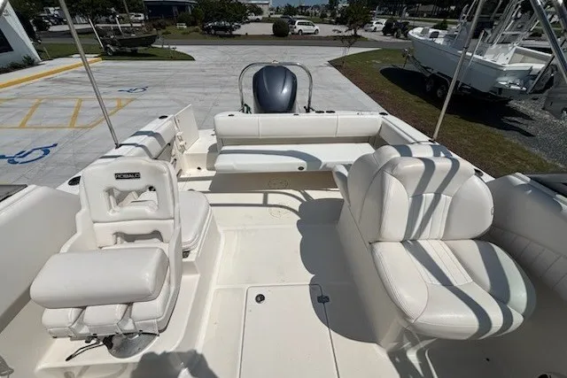 Slide: The Image of 2009 Robalo R227 Dual Console boat interior with white seating and spacious layout. - 6