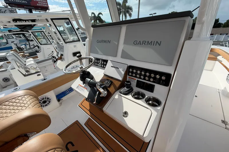 Slide: The Image of Interior of 2027 Caymas 29 CT boat with Garmin navigation system and luxurious seating. - 10