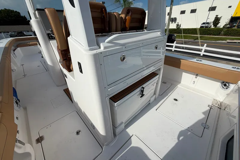 Slide: The Image of 2027 Caymas 29 CT boat interior with seating and storage compartments. - 6