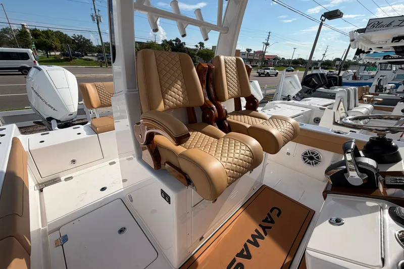 Slide: The Image of Luxurious seating on 2027 Caymas 29 CT boat, featuring quilted leather and modern design. - 12