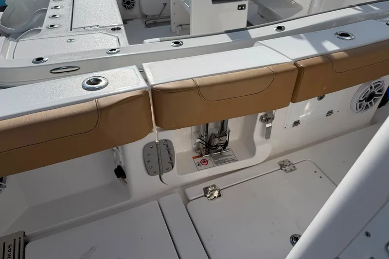 Slide: The Image of 2027 Caymas 29 CT boat interior with tan seating and white deck. - 5