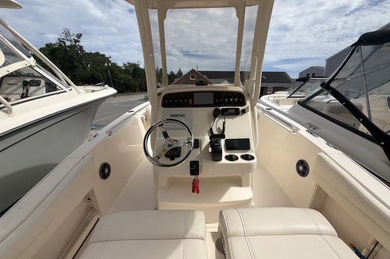 Slide: The Image of 2023 Grady-White Fisherman 216 boat interior with steering console and seating. - 7