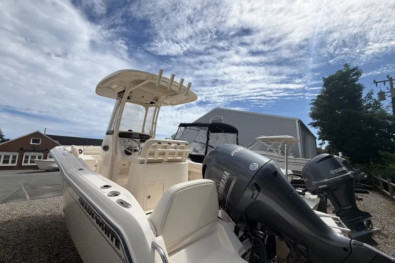 Slide: The Image of 2023 Grady-White Fisherman 216 boat with Yamaha outboard engines, parked outdoors. - 3