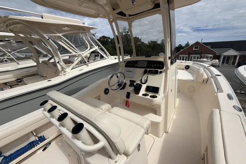 Slide: The Image of 2023 Grady-White Fisherman 216 boat interior with helm and seating area. - 6