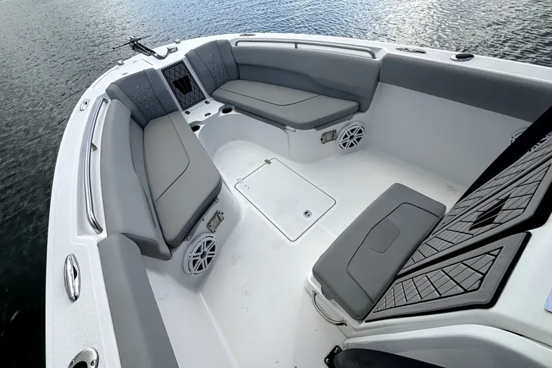 Slide: The Image of 2022 Wellcraft 242 Scarab Offshore boat interior with gray seating and water view. - 6