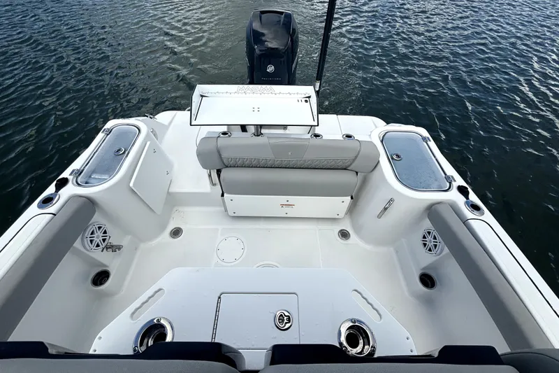 Slide: The Image of 2022 Wellcraft 242 Scarab Offshore boat interior with seating and fishing amenities. - 10