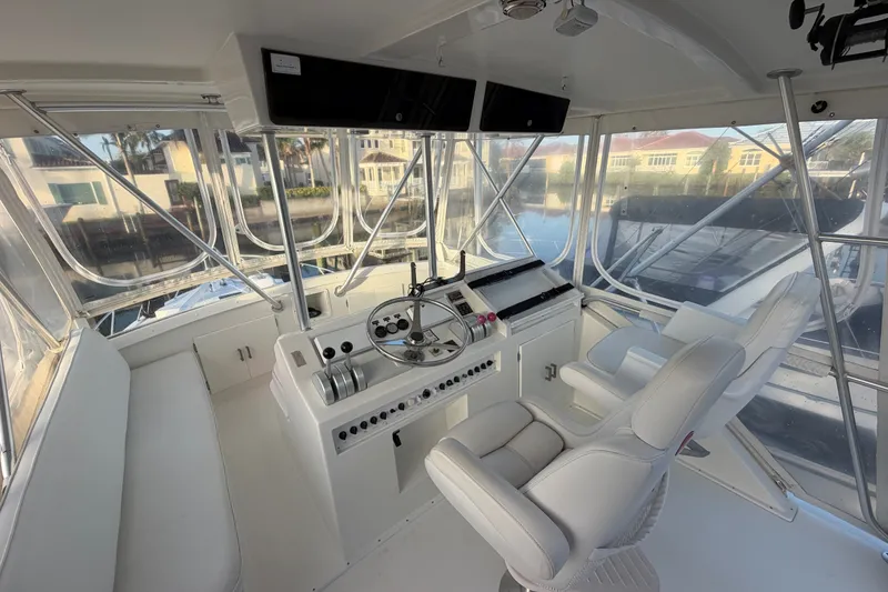 Slide: The Image of Interior of a 1996 Post 46 Convertible yacht with helm and seating. - 9