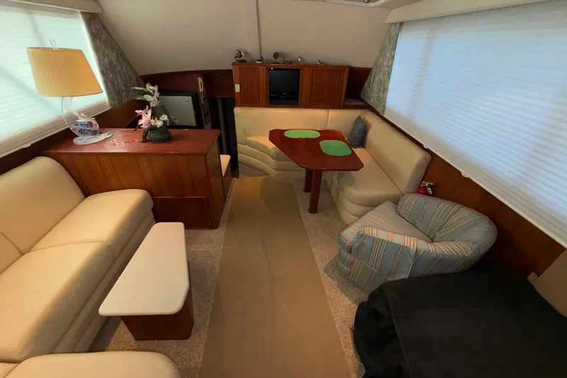 Slide: The Image of Luxurious interior of a 1996 Post 46 Convertible yacht with elegant seating and decor. - 14