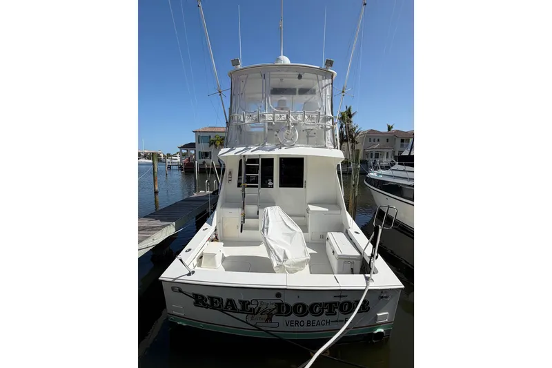 Slide: The Image of 1996 Post 46 Convertible yacht docked at marina, clear sky, Vero Beach. - 2