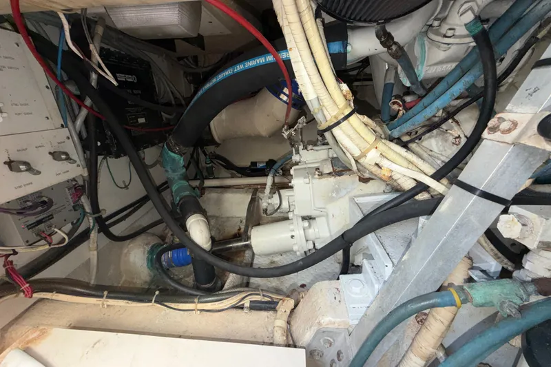 Slide: The Image of Engine room of a 1996 Post 46 Convertible boat with visible wiring and machinery. - 30
