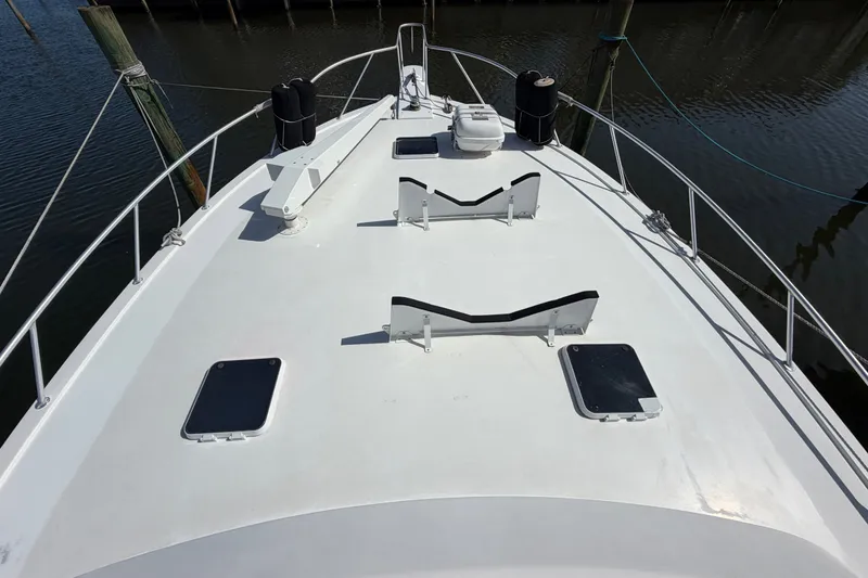 Slide: The Image of 1996 Post 46 Convertible yacht deck with hatches, docked at marina. - 5