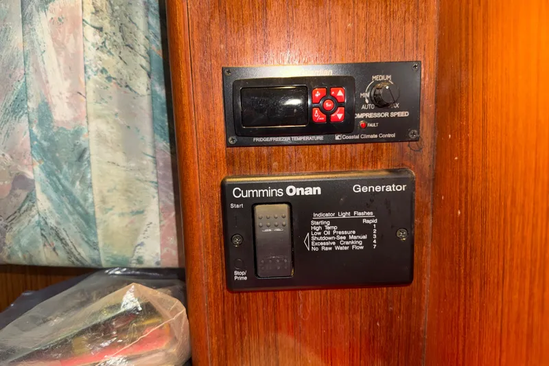 Slide: The Image of Control panel on a 1996 Post 46 Convertible boat with Cummins Onan generator. - 27