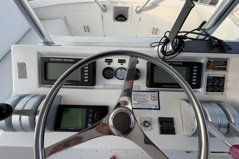 Slide: The Image of Control panel of a 1996 Post 46 Convertible boat with Detroit Diesel displays. - 11