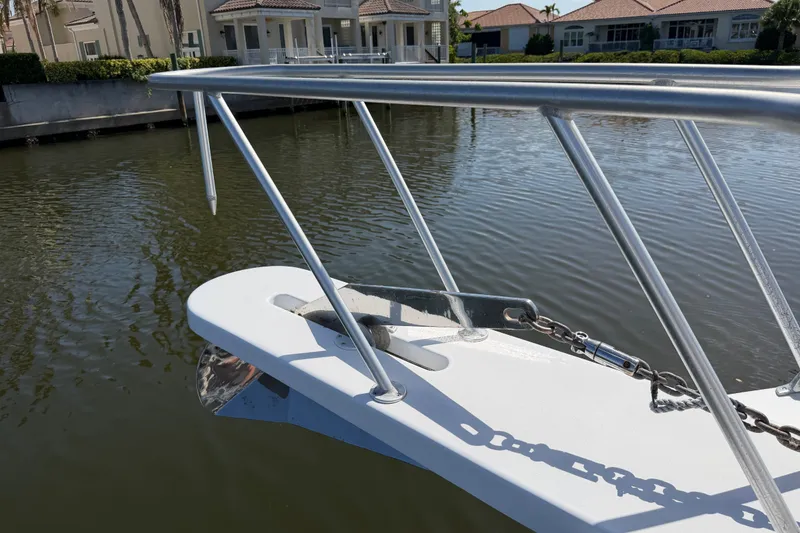 Slide: The Image of Bow of a 1996 Post 46 Convertible boat with anchor and chain in a marina. - 6