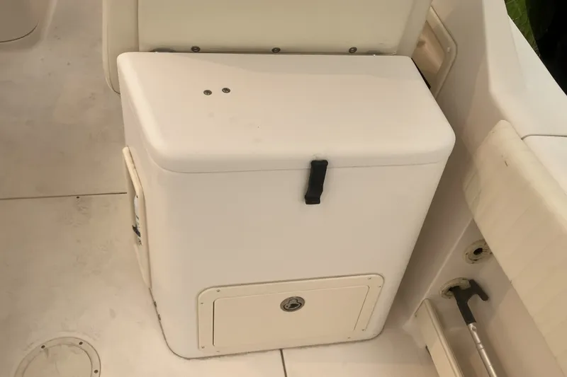 Slide: The Image of 2008 Grady White 275 Tournament boat interior with storage compartment and seating. - 23