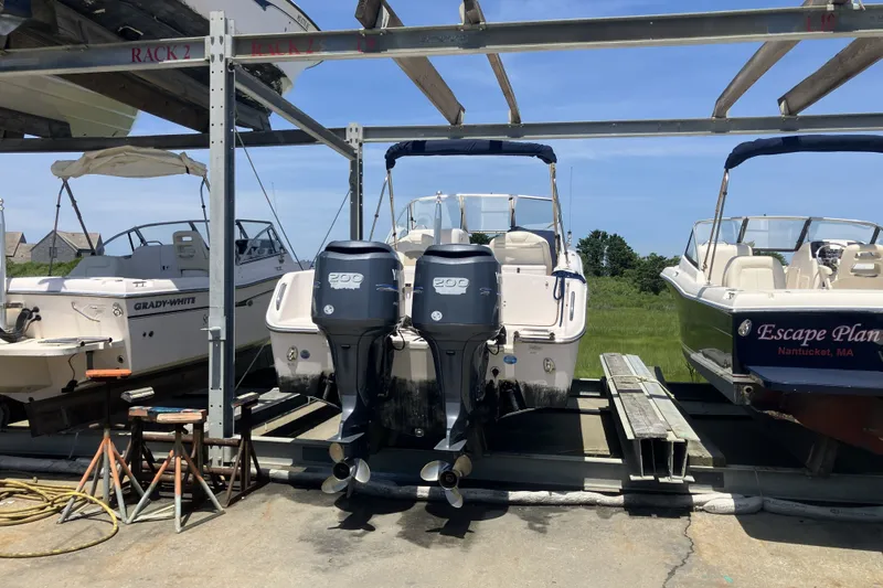Slide: The Image of 2008 Grady White 275 Tournament boat with dual engines on a storage rack. - 8