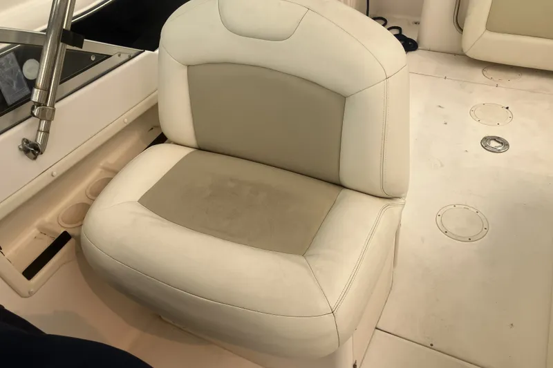 Slide: The Image of Cream-colored seat on a 2008 Grady White 275 Tournament boat deck. - 33