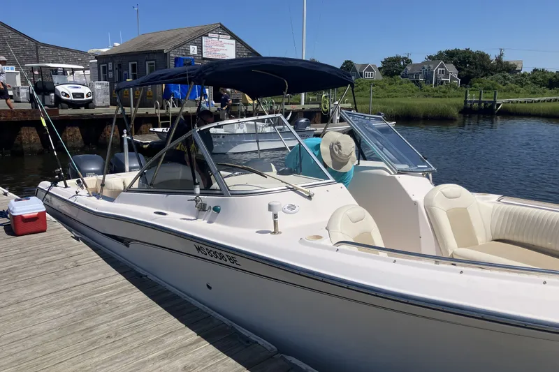 Slide: The Image of 2008 Grady White 275 Tournament boat docked at a marina on a sunny day. - 6