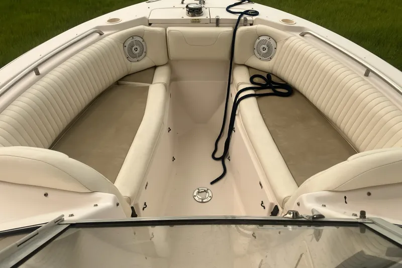 Slide: The Image of 2008 Grady White 275 Tournament boat interior with cushioned seating and speakers. - 35