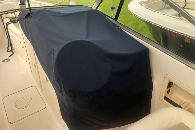 Slide: The Image of 2008 Grady White 275 Tournament boat interior with covered console and seating area. - 34