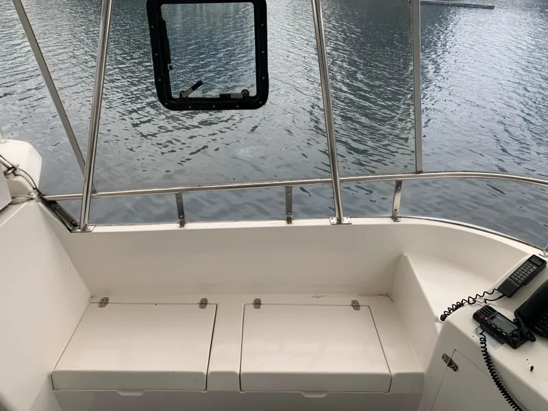 Slide: The Image of 1991 TransWorld Cockpit Motoryacht interior with seating and water view. - 30