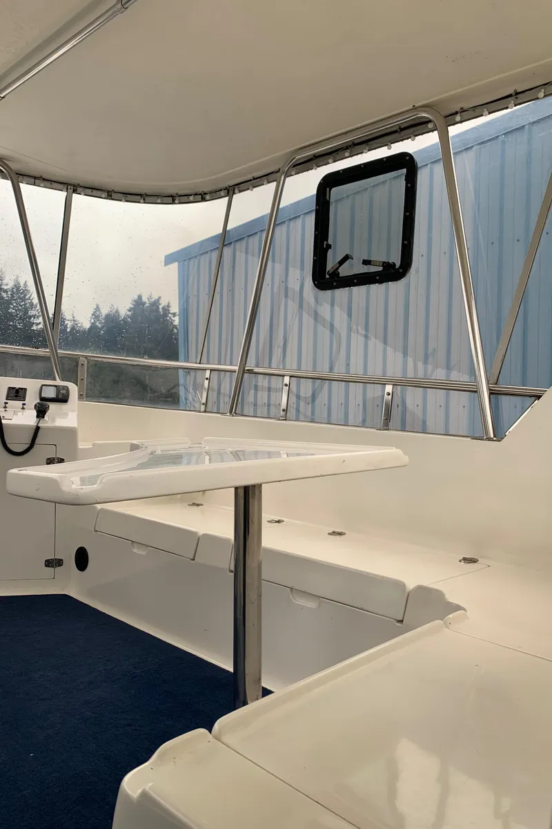Slide: The Image of 1991 TransWorld Cockpit Motoryacht interior with seating and table. - 36