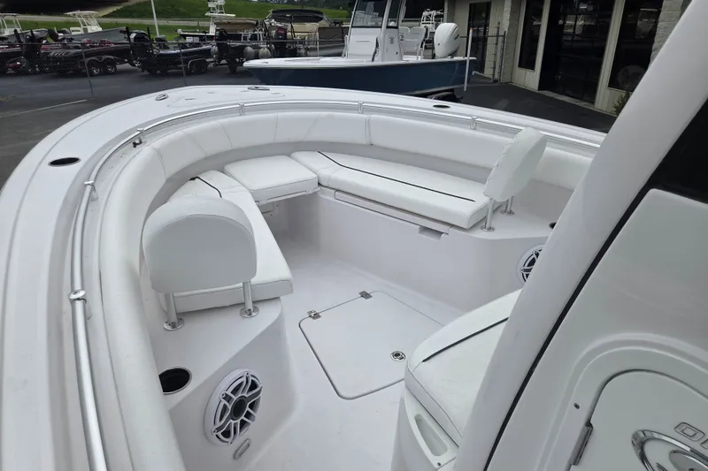 Slide: The Image of 2026 Sportsman Open 232 Center Console boat interior with white seating and modern design. - 7