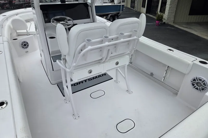 Slide: The Image of 2026 Sportsman Open 232 Center Console boat interior with seating and steering wheel. - 13
