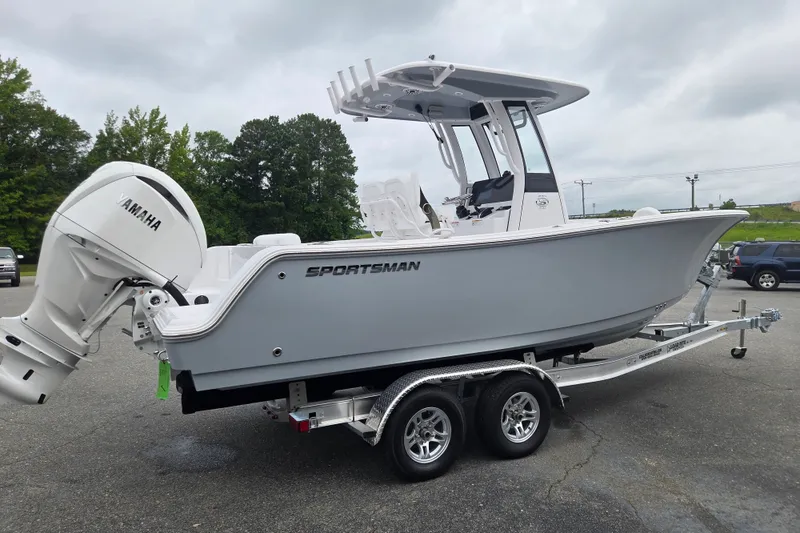 Slide: The Image of 2026 Sportsman Open 232 Center Console boat on trailer, featuring Yamaha outboard motor. - 4