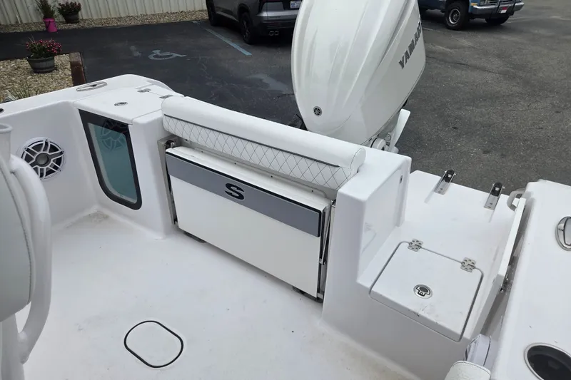 Slide: The Image of 2026 Sportsman Open 232 Center Console boat interior with seating and storage. - 14