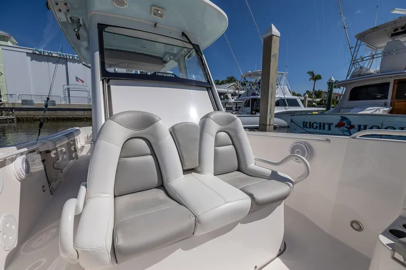 Slide: The Image of 2011 Everglades 295 Center Console boat with dual seating, docked at marina. - 39