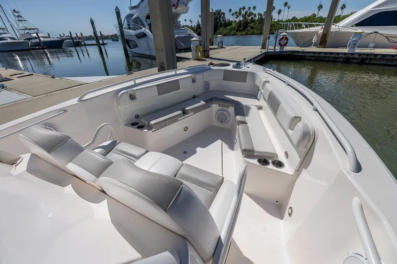 Slide: The Image of 2011 Everglades 295 Center Console boat interior with spacious seating at marina. - 41