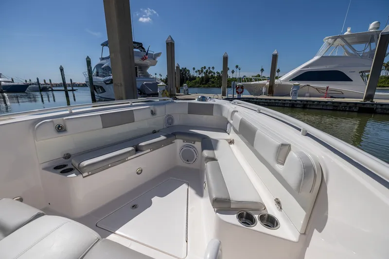 Slide: The Image of 2011 Everglades 295 Center Console boat interior with seating, docked at marina. - 40