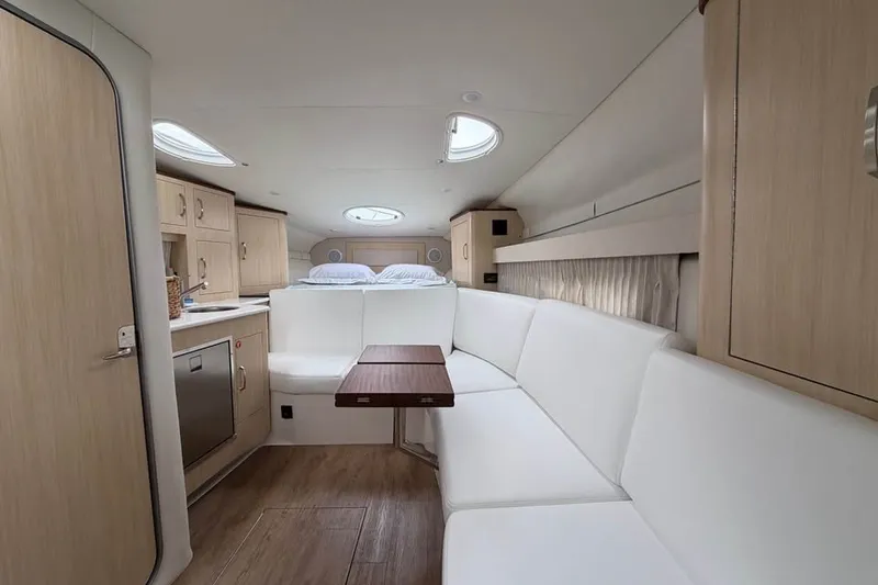 Slide: The Image of Luxurious interior of 2025 Regal 33 Express yacht with modern seating and cabinetry. - 10