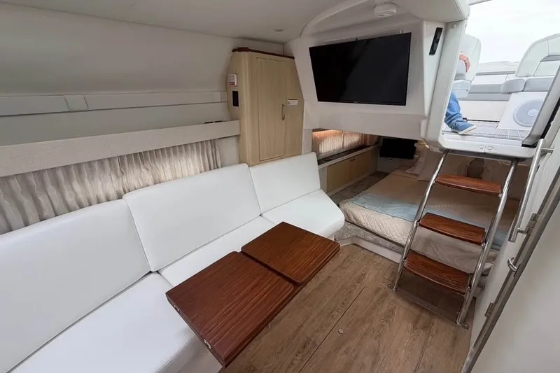 Slide: The Image of Luxurious interior of 2025 Regal 33 Express yacht with modern seating and entertainment system. - 12